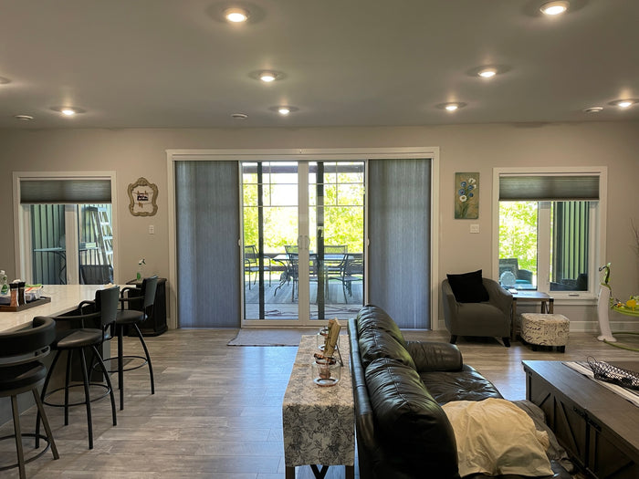 Cellular shades are great for insulating and energy efficiency and come in a vertical application for patio doors