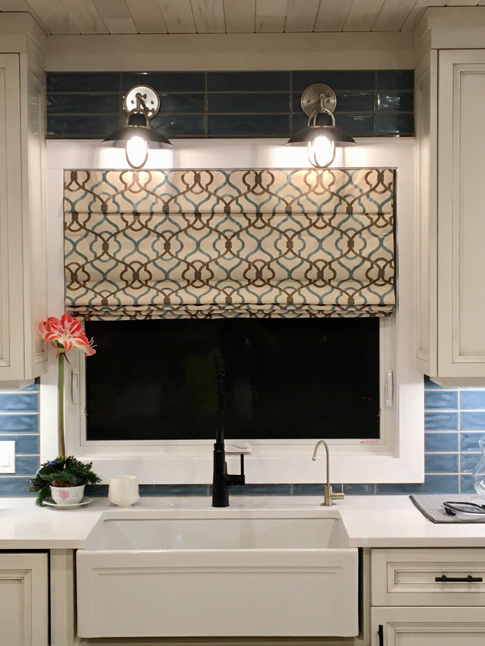 Add some flair to your kitchen with a patterned roman shade