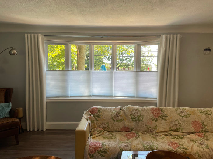 Keep your privacy and the light in your room with day and night cellular shades. Drapery adds a cozy feel and blocks out the light when you need a few extra z's